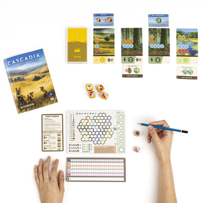 Cascadia: Rolling Hills – roll-and-write gameplay with cards and pencil